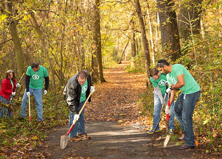 IP volunteers work to clean up a local park.